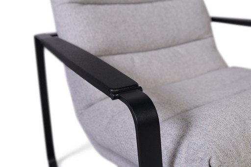 Poltroncina + pouf Leolux Indra