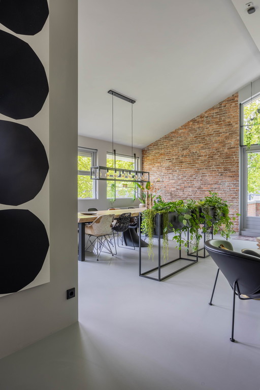 2 Room dividers made of black exposed metal with waterproof plant bags