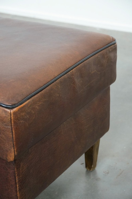 Image 1 of Vintage sheepskin stool with black piping