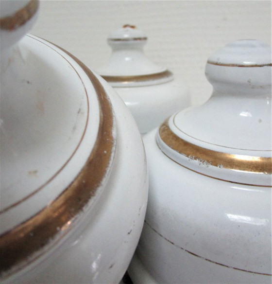 Image 1 of four enameled metal cheese bells, early 20th century