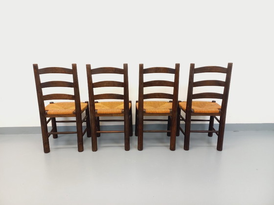 Image 1 of Set van 4 vintage brutalistische stoelen van Georges Robert, gemaakt van hout en stro, uit de jaren 50 en 60.