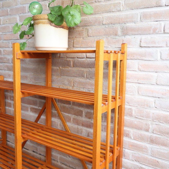 Image 1 of Libreria vintage con ante a doghe aperte, giocattoli e libri