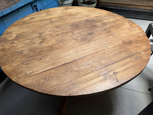 Old wooden round dining table