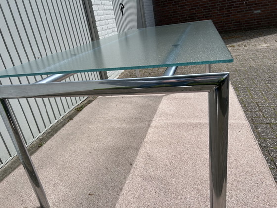 Image 1 of Ensemble de salle à manger Hülsta D2 – table à manger en verre avec 4 chaises en cuir noir à piètement luge