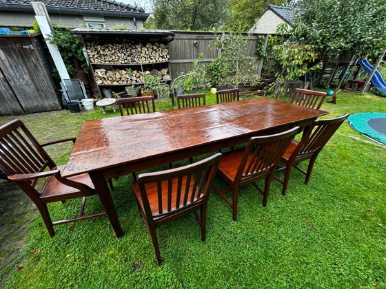 Image 1 of Grande table de salle à manger coloniale en teck massif avec 8 chaises et coussins