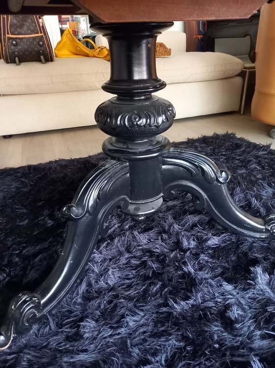 Image 1 of Antique round table on wheels