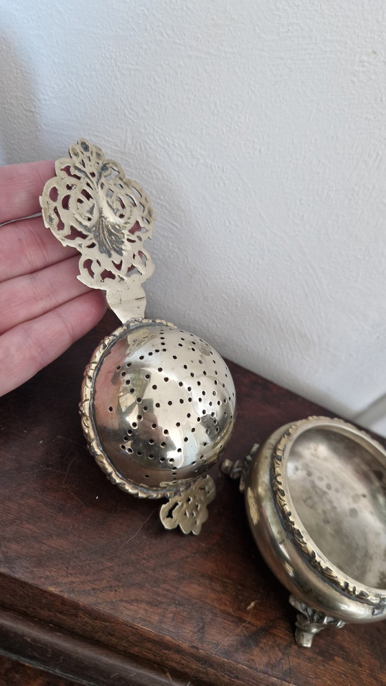 Image 1 of Antique tea strainer and drip tray. Silver-plated?