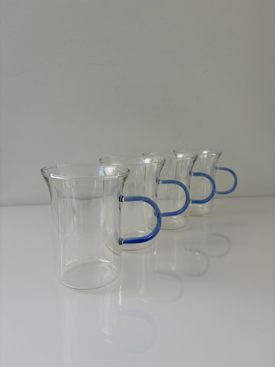 Image 1 of Set of four glass tea mugs with colored handles