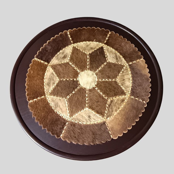 Image 1 of Vintage round coffee table with loose patchwork of cowhide