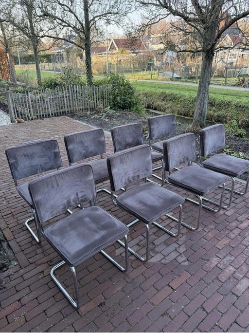 8 sillas de tela acanalada pura con estructura tubular cromada