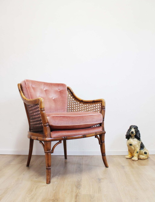Vintage armchair with pink velvet cushions. Rattan Boho chair, Giorgetti?
