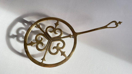 Image 1 of Solid brass trivet