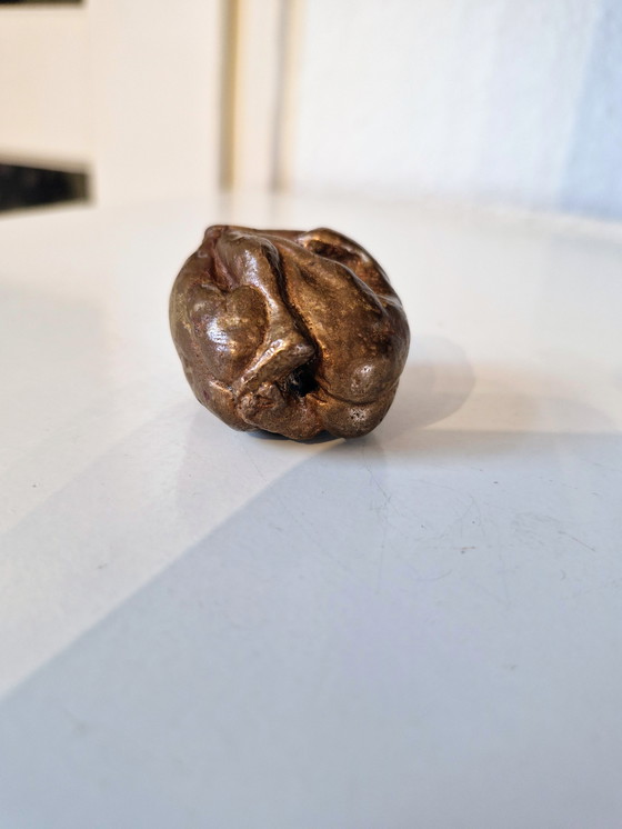 Image 1 of Solid small bronze statuette of two figures stamped into each other.