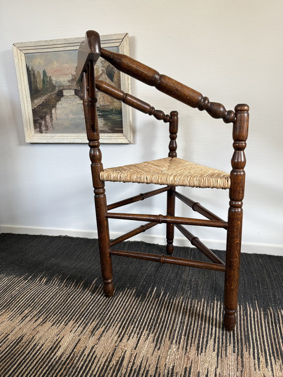 Image 1 of  Vintage Antiek 20ste eeuw eiken hoekstoel met biezen zitting h85cm