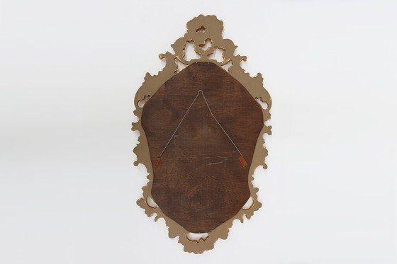 Image 1 of French Rococo or Baroque style facet-cut crest mirror in gilded carved wood
