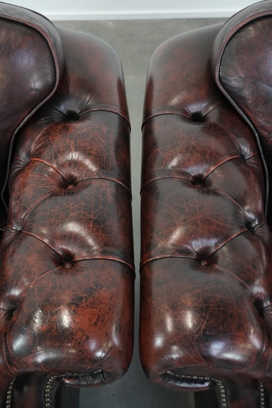 Image 1 of 2 Chesterfield-Sessel im englischen Stil mit rotem, geflammtem Rindslederbezug in gutem Zustand