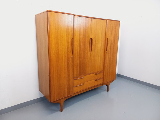 Image 1 of Scandinavische vintage kledingkast in teakhout uit de jaren 60 van ontwerpers Tricoire en Vecchione voor "Meubles TV Paris".