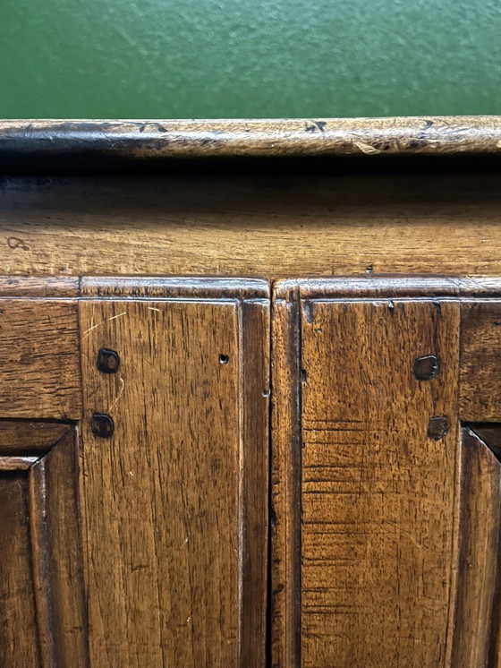 Image 1 of A very small rustic walnut sideboard
