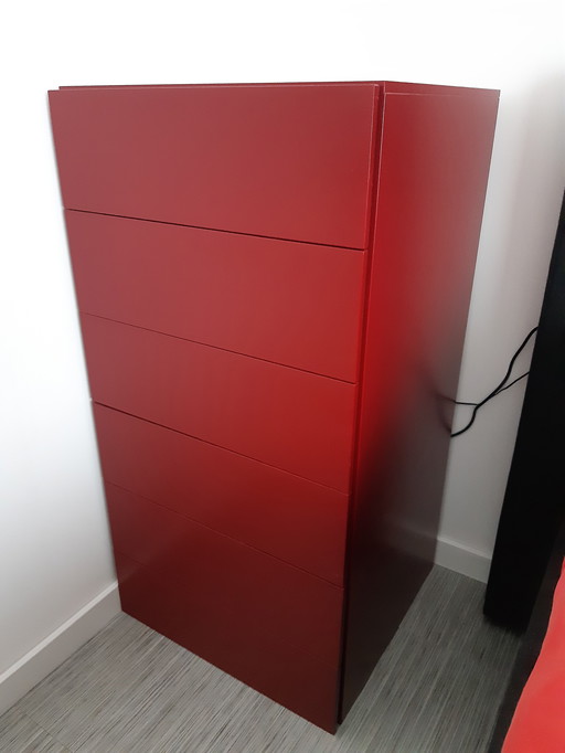 Two sleek, ruby red, designer chest of drawers