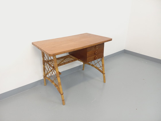 Image 1 of Vintage Louis Sognot bureau in rotan en hout uit de jaren 60