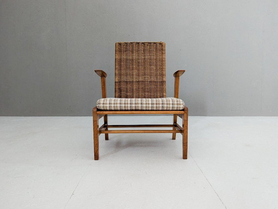 Image 1 of Skulpturaler Sessel aus Buche und Rattan mit Fußhocker von ÚĽUV, 1960er Jahre