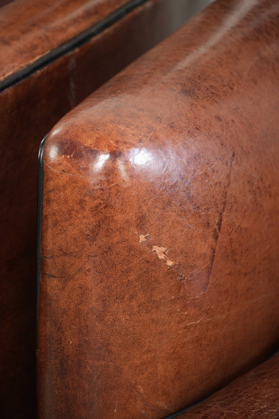 2 fauteuils en peau de mouton au design unique, avec passepoil noir et couleurs profondes. – Leather (photo 15 of 20)