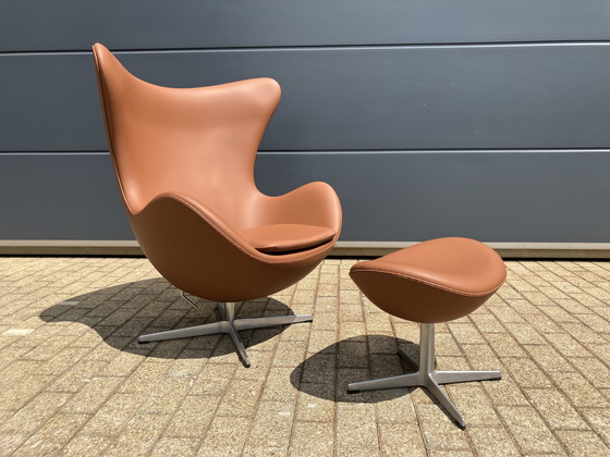 Image 1 of 2x Fritz Hansen Egg Chair + Ottoman en cuir Cognac NEUF !!!