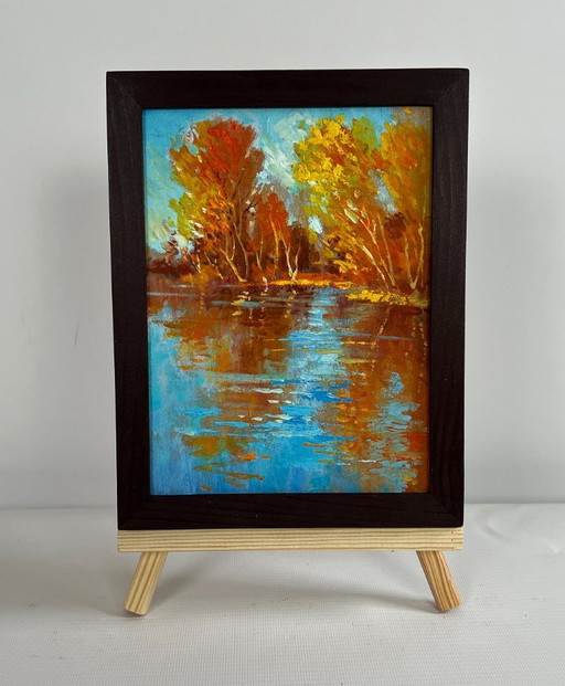 Origineel olieverfschilderij: Herfstlandschap aan een rivier, gouden weerspiegeling van het bos.
