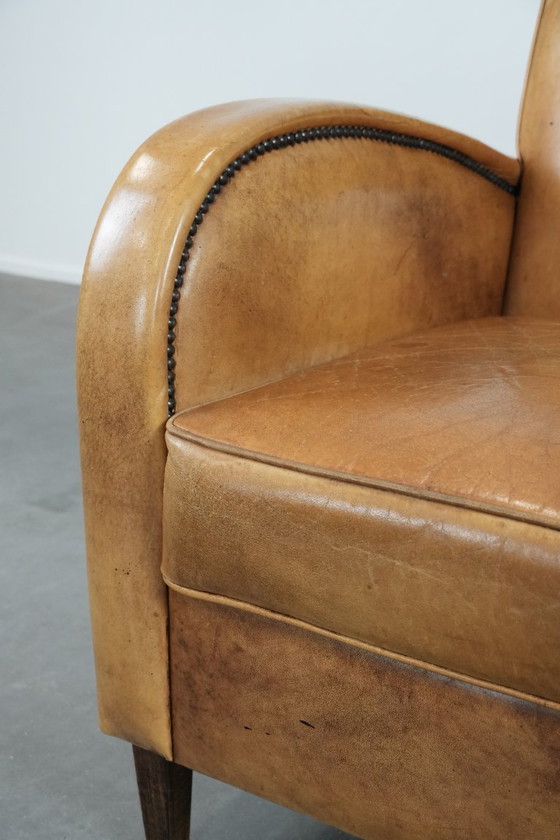 Image 1 of Luxurious armchair made of cowhide leather with a beautiful warm color scheme