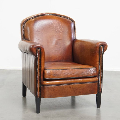 Cognacfarbener Sessel mit Schafsfellmuster