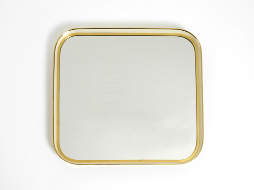 Beautiful original Mid Century Modern "Zier-Form" wall mirror with heavy brass frame by "Münchener Zierspiegel"