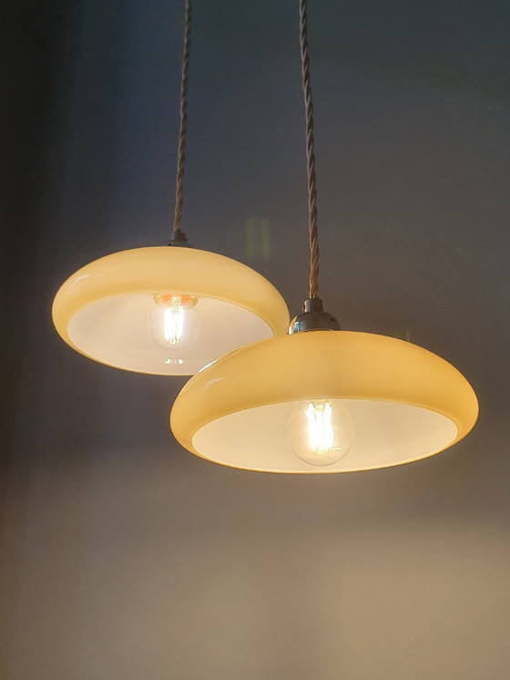 Image 1 of Vintage French pendant lamp set - of pastel yellow opaline glass.
