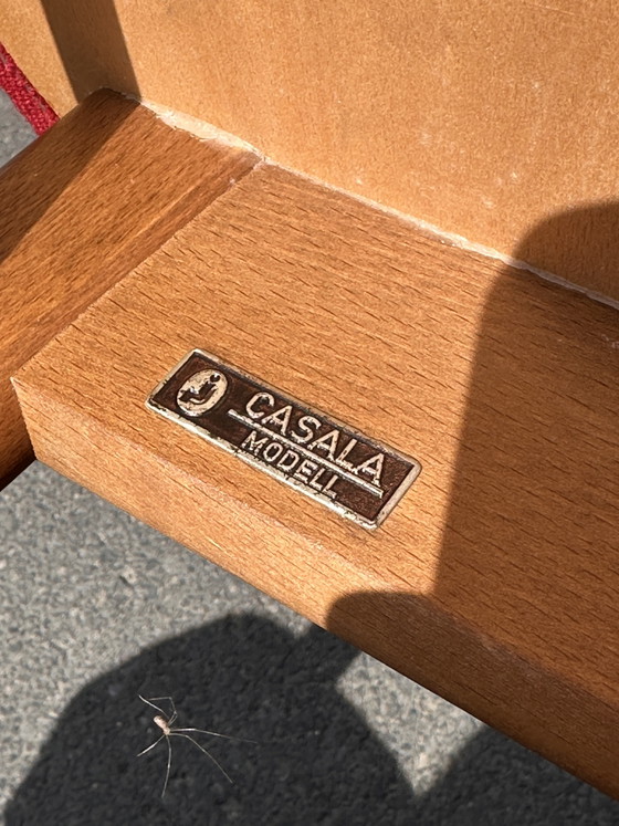 Image 1 of Casala designstoel – massief hout met rode bekleding – in uitstekende staat