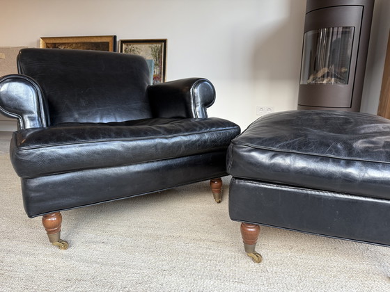 Image 1 of Baxter fauteuil + hocker, model Charlotte Longe (zwart leer)