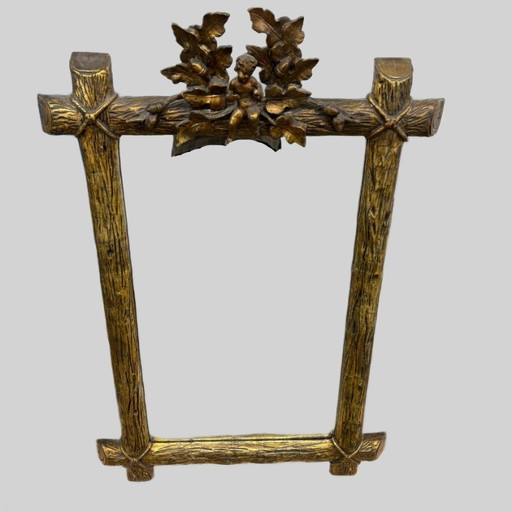 Miroir ancien doré, décor de chérubin et de feuille de chêne