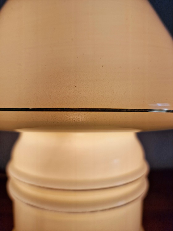 Image 1 of Vintage table lamp by Massive, with a glass base and shade.

With gold accents