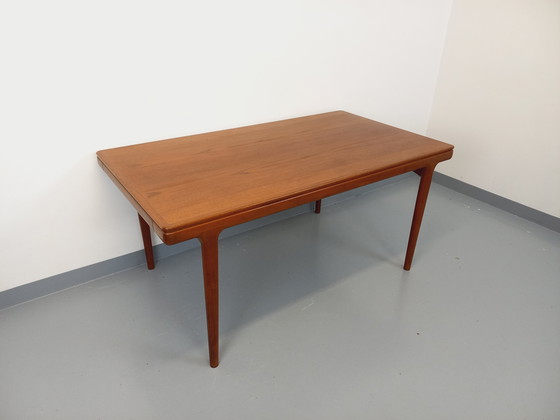 Image 1 of Scandinavian rectangular vintage dining table by Johannes Andersen for Samcom from the 60s in teak with integrated extensions