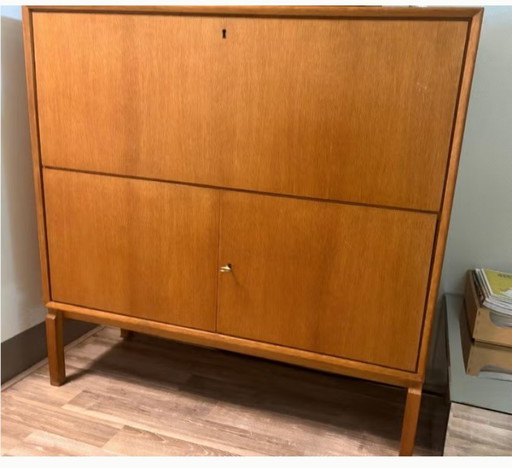 Wooden liquor cabinet with flap door, light brown
