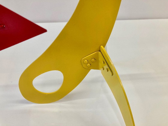 Image 1 of Yellow Stabile, 11 red triangles