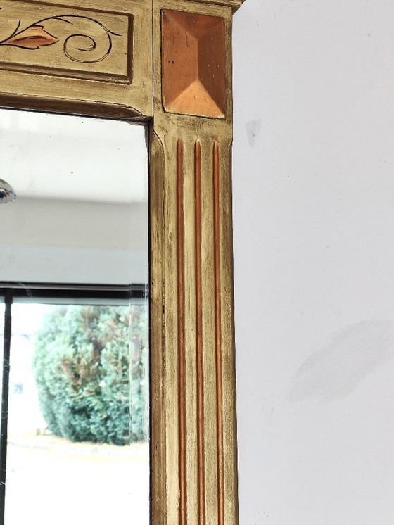 Image 1 of Gilded wooden mirror with carved pediment in the trumeau style