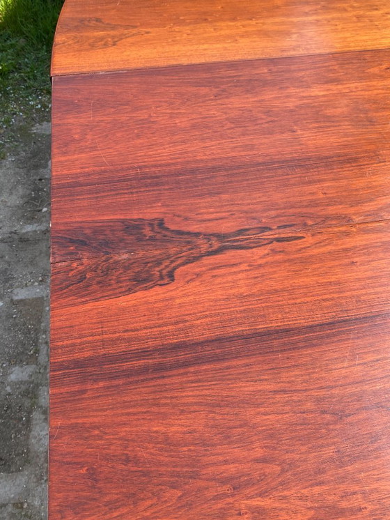 Image 1 of Baumann round oval extendable Scandinavian table in rosewood with 2 extensions, length 166 to 256cm, an60