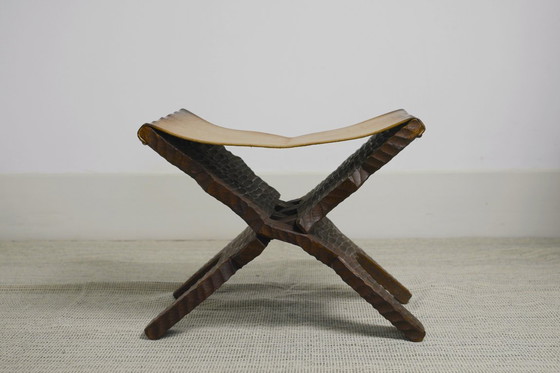 Image 1 of Brutalist Folding Stool Leather Sling Seat Hand Carved Wood X Frame 1950s Rustic Mid Century Ottoman