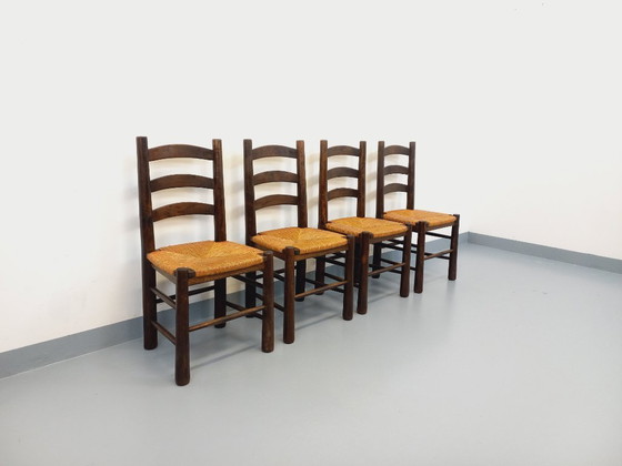 Image 1 of Set van 4 vintage brutalistische stoelen van Georges Robert, gemaakt van hout en stro, uit de jaren 50 en 60.