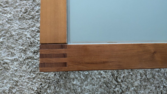 Image 1 of cherry wood red coffee table with sleek glass top from 1996