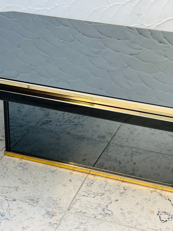 Tweekleurige salontafel van messing en zwart spiegelglas van Fedam (photo 4 of 18)