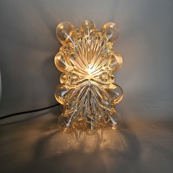 Image 1 of Vintage glass bubble wall lamp by Glashutte Limburg. Design by Helena Tynell. Glass and brass. 1960, Germany.