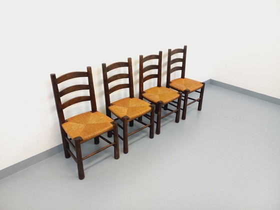 Image 1 of Set van 4 vintage brutalistische stoelen van Georges Robert, gemaakt van hout en stro, uit de jaren 50 en 60.