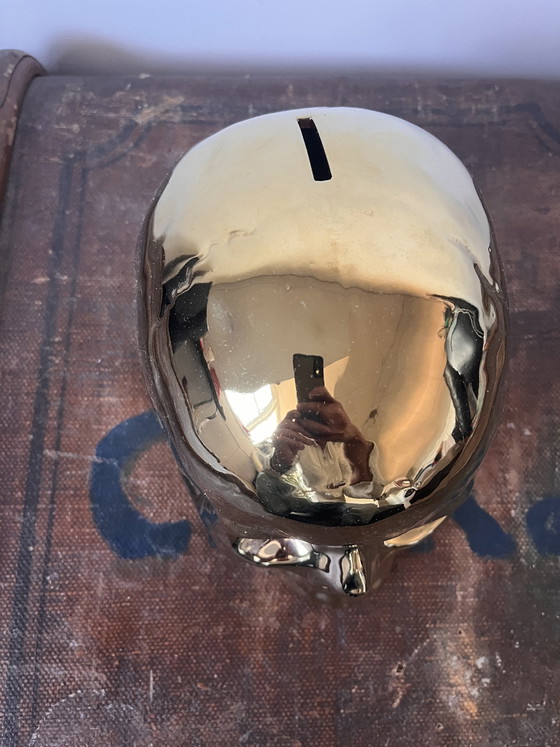 Image 1 of Golden skull piggy bank real life size