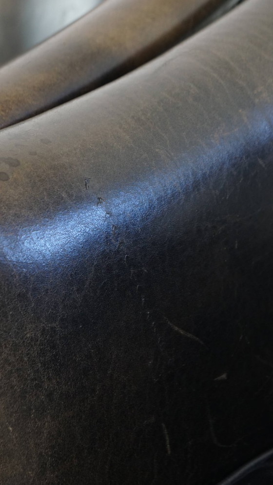 Image 1 of  Set van 2 subtiele zwart/ grijze schapenleren clubfauteuils 