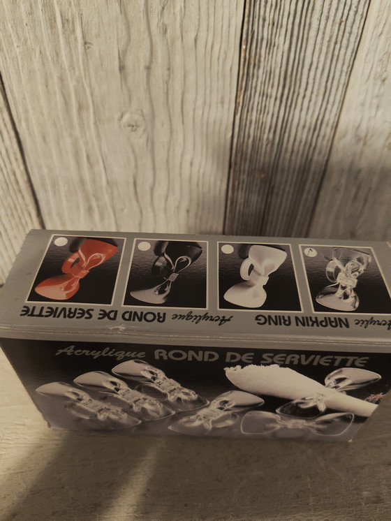Image 1 of Set of 6 clear acrylic bow-shaped napkin rings, new in box